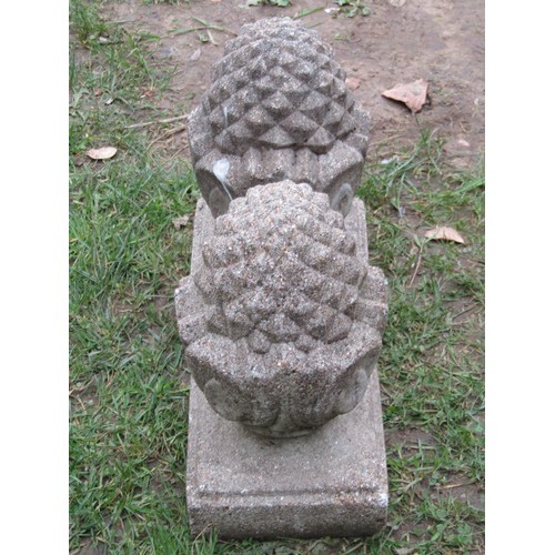 263 - A pair of small weathered cast composition stone pier caps with pineapple finials, 32cm high x 18cm ... 