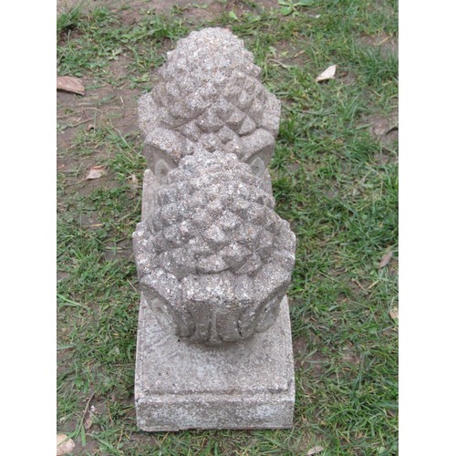 263 - A pair of small weathered cast composition stone pier caps with pineapple finials, 32cm high x 18cm ... 