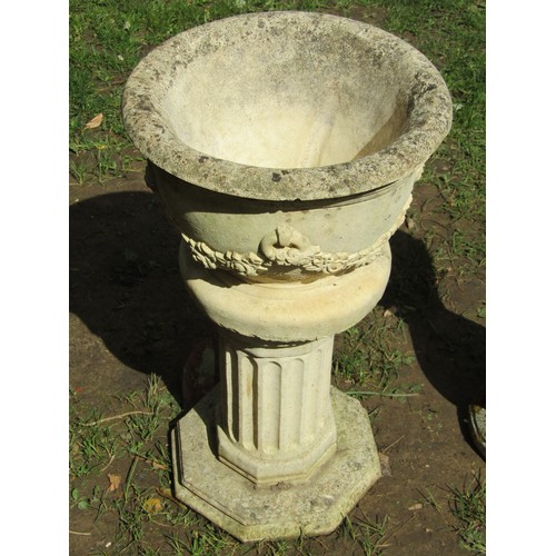 269 - A small weathered cast composition stone garden urn, the circular bowl with flared rim and repeating... 