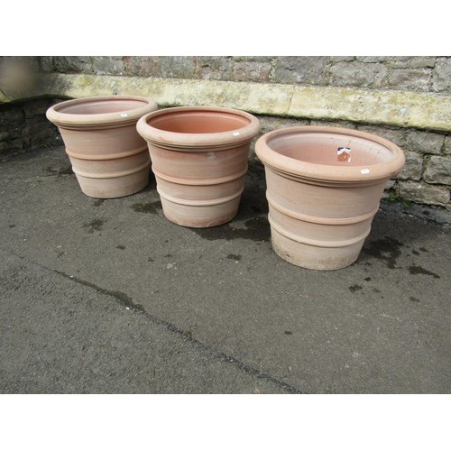 270 - Three terracotta planters of circular tapered, ribbed form, stamped Deroma, 50cm diameter x 40cm hig... 