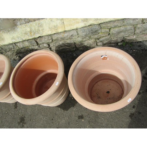 270 - Three terracotta planters of circular tapered, ribbed form, stamped Deroma, 50cm diameter x 40cm hig... 