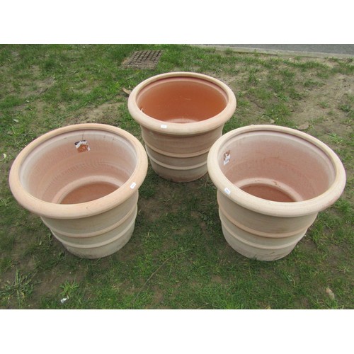 270 - Three terracotta planters of circular tapered, ribbed form, stamped Deroma, 50cm diameter x 40cm hig... 