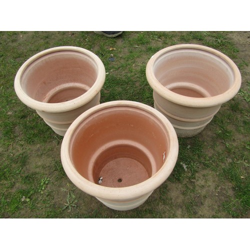 270 - Three terracotta planters of circular tapered, ribbed form, stamped Deroma, 50cm diameter x 40cm hig... 