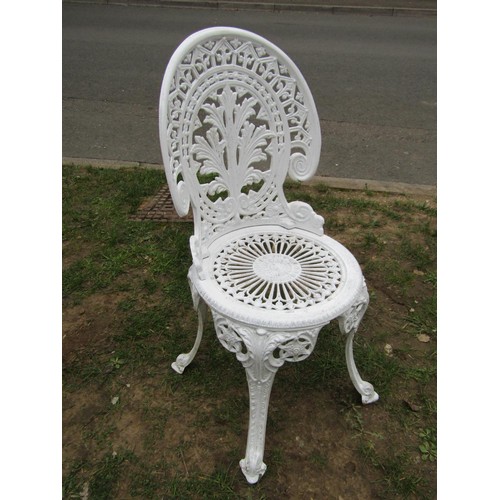 272 - A cream painted cast aluminium garden table of circular form with decorative pierced scrolling folia... 