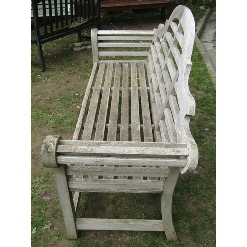 286 - A weathered (silvered) teak Lutyens style three seat garden bench, 166 cm wide