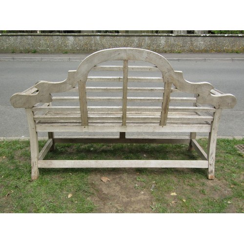 286 - A weathered (silvered) teak Lutyens style three seat garden bench, 166 cm wide