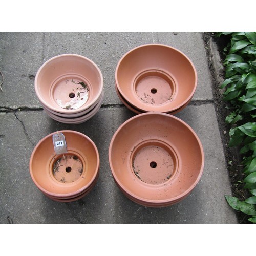 211 - Twelve shallow squat circular terracotta planters (varying size), the larger examples 14 cm x 36 cm ... 