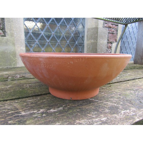 211 - Twelve shallow squat circular terracotta planters (varying size), the larger examples 14 cm x 36 cm ... 