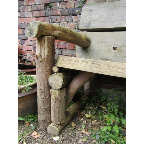 233 - A rustic wooden two seat garden bench 145 cm wide