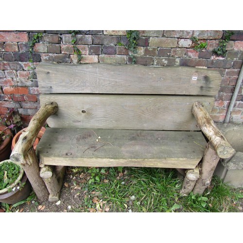 233 - A rustic wooden two seat garden bench 145 cm wide