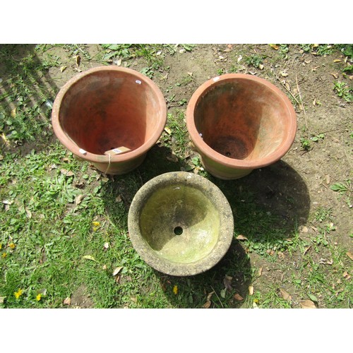 237 - A pair of weathered terracotta garden planters of circular tapered form with lions mask detail 30 cm... 