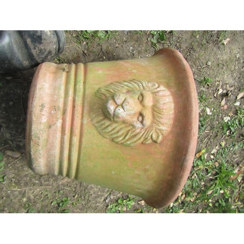 237 - A pair of weathered terracotta garden planters of circular tapered form with lions mask detail 30 cm... 