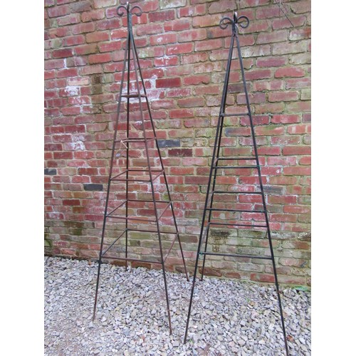 253 - A weathered tall pyramid shaped steel garden obelisk with open scroll finial approx 240 cm high toge... 