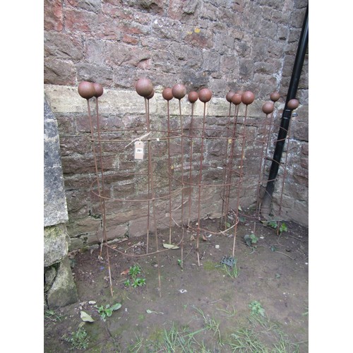 261 - Three weathered light steel garden obelisks of cylindrical open ring form with ball finials, 120 cm ... 