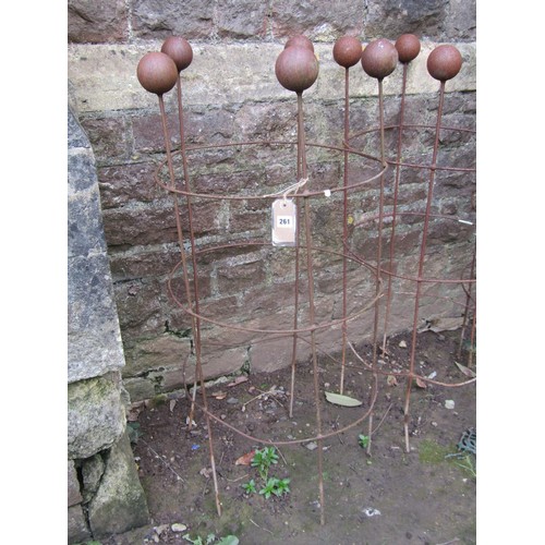 261 - Three weathered light steel garden obelisks of cylindrical open ring form with ball finials, 120 cm ... 