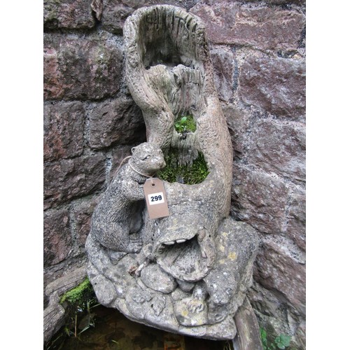 A weathered cast composition stone garden water feature with Otter ...