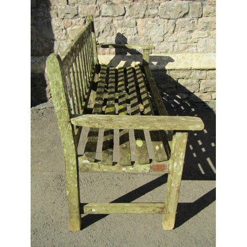 283 - A vintage R A Lister weathered teak three seat garden bench with slatted seat and back, 159 cm wide