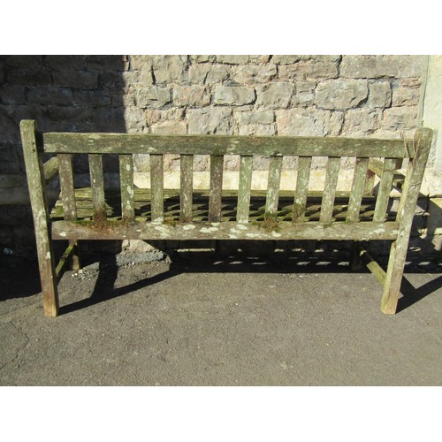 283 - A vintage R A Lister weathered teak three seat garden bench with slatted seat and back, 159 cm wide