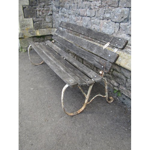 284 - An old unusual garden bench with weathered timber slatted seat and back (able to fold) raised on pai... 