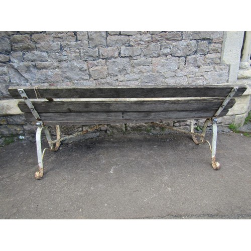 284 - An old unusual garden bench with weathered timber slatted seat and back (able to fold) raised on pai... 