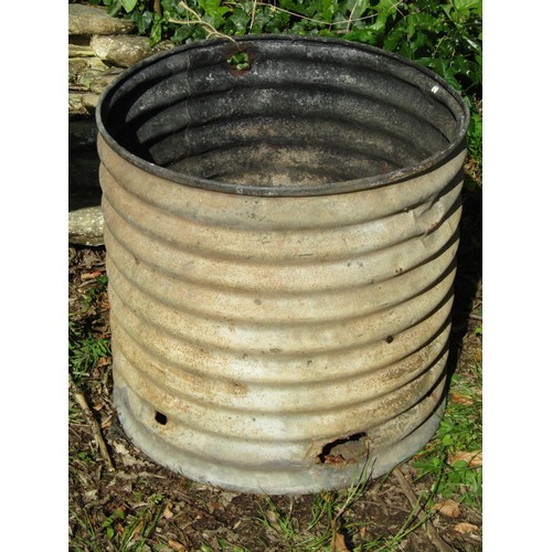 A corrugated galvanised tank, later, use that as a planter or possibly incinerator, 53cm high, 53cm diameter.