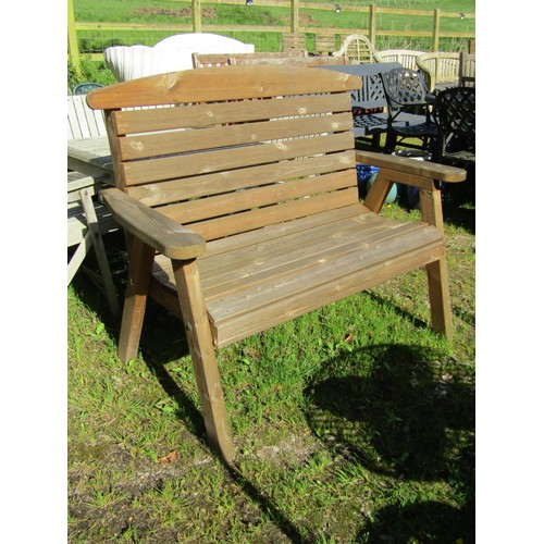 A contemporary weathered softwood 2 seat garden bench with slatted seat and back raised on splayed supports, 127cm wide