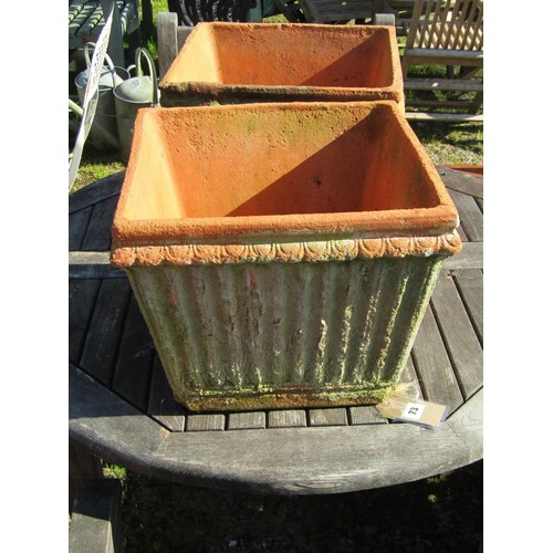 73 - A pair of weathered terracotta square tapered and reeded planters, 30 cm high x 38 cm square approxi... 