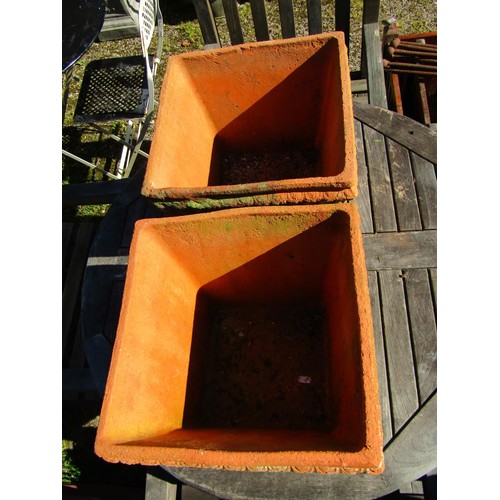 73 - A pair of weathered terracotta square tapered and reeded planters, 30 cm high x 38 cm square approxi... 