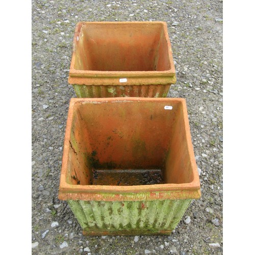 73 - A pair of weathered terracotta square tapered and reeded planters, 30 cm high x 38 cm square approxi... 