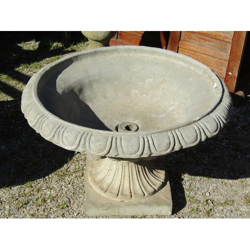 79 - A pair of cast composition stone garden urns, the squat circular lobbed  bowls with egg and dart fla... 