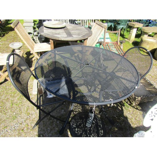 93 - A contemporary Kettler coated light steel circular garden terrace table raised on swept supports, 11... 