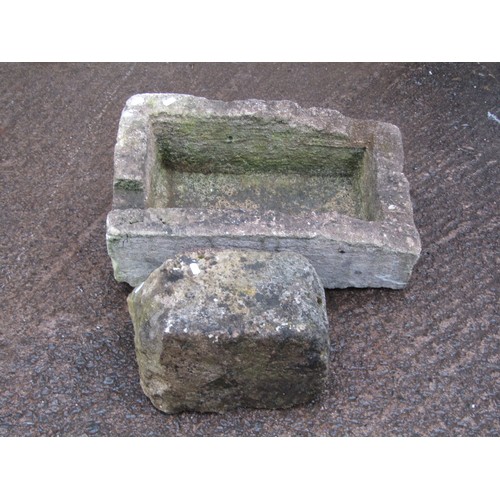 A weathered Cotswold Studios Ltd two sectional cast composition stone garden sundial raised on a simulated rough hewn square tapered pedestal and square stepped base, the top 35 cm diameter x 58 cm high approximately