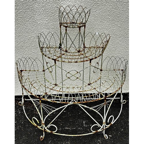 516 - A weathered Victorian style wire work freestanding three tier conservatory/garden planter with latti... 