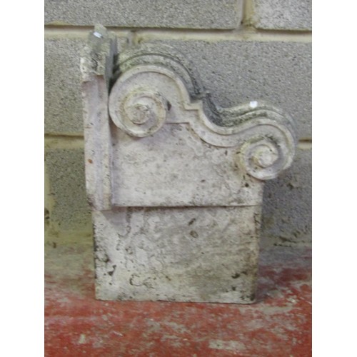 520 - A carved natural stone corbel with scroll detail 40 cm high x 53 cm x 24 cm