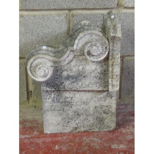 520 - A carved natural stone corbel with scroll detail 40 cm high x 53 cm x 24 cm