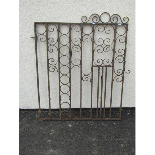 526A - An old weathered ironwork garden gate with scrolling detail, 104cm high, 96cm wide