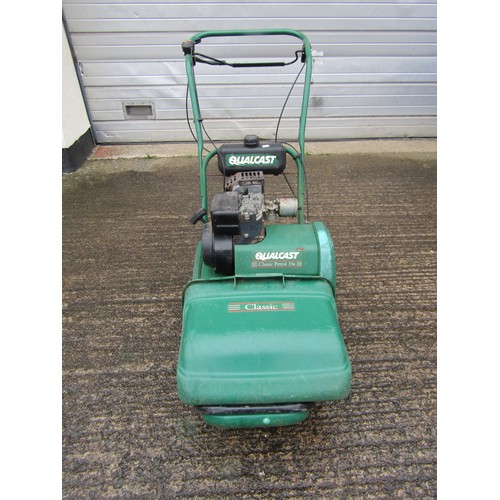 A Qualcast Classic petrol 35S cylinder lawn mower with grass collection box