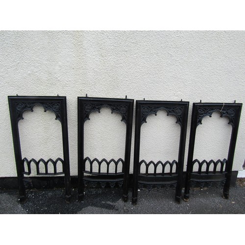 532 - A matched set of four gothic 19th century cast iron fire place surrounds, each measuring 84 x 39