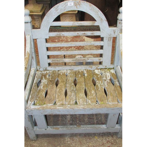 509 - A weathered teak garden chair with worn pale blue painted finish. Wide generous slatted seat & back ... 