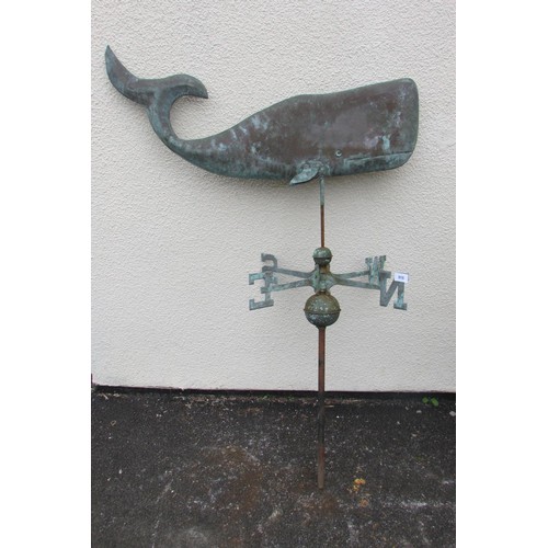 An unusual decorative weathervane in the form of a stylised blue whale ...