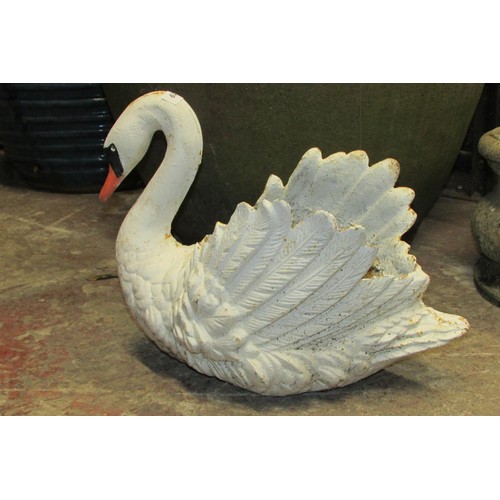 519 - A heavy antique cast iron planter in the form of a swan with painted finish, 38cm high, 45cm wide