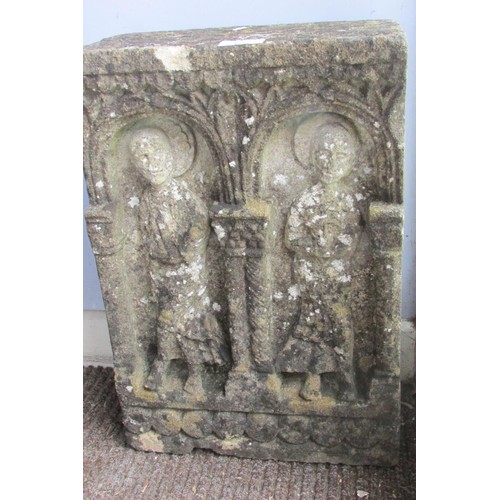 531 - A weathered carved limestone panel in the old English / medieval style, decorated with stylised figu... 