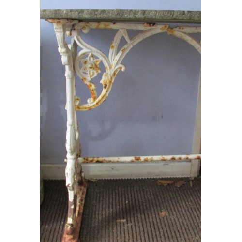 535 - A Victorian cast iron tavern table, the scrolling trestle framework with white painted finish, below... 