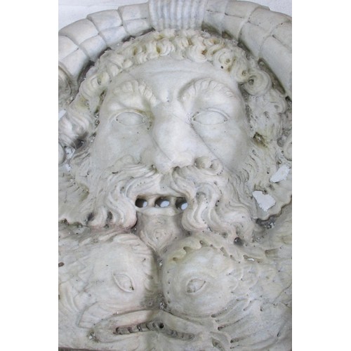 548 - A large and impressive continental carved marble fountain head, detailing a mask of Poseidon above s... 