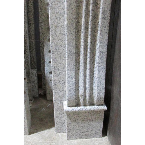 555 - A grey polished marble country house fire place surround, with fluted frieze and scrolled supports