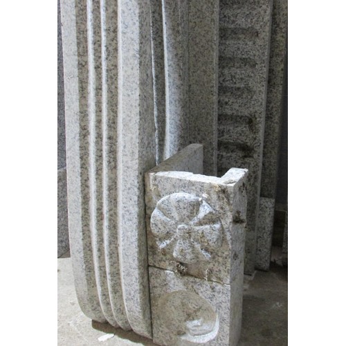 556 - A grey polished marble country house fire place surround, with fluted frieze and scrolled supports