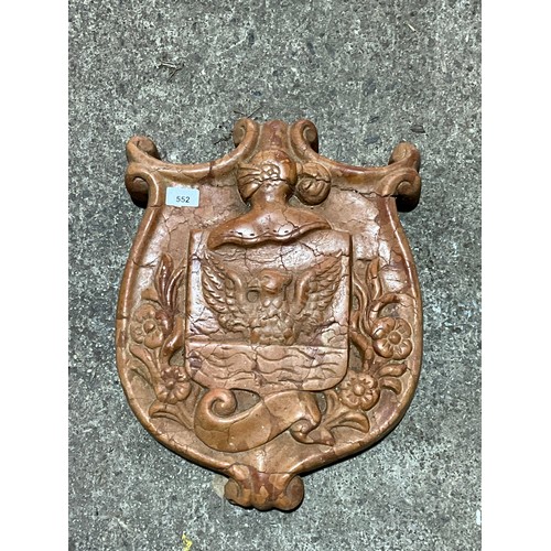 552 - A decorative continental carved red marble armorial shield, 46 x 36cm