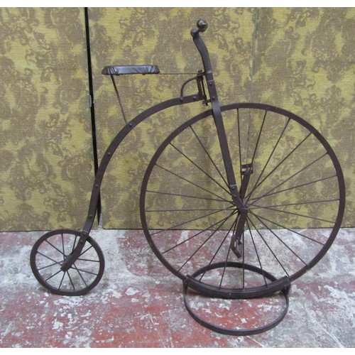 562A - A decorative model penny farthing bicycle, 105cm high