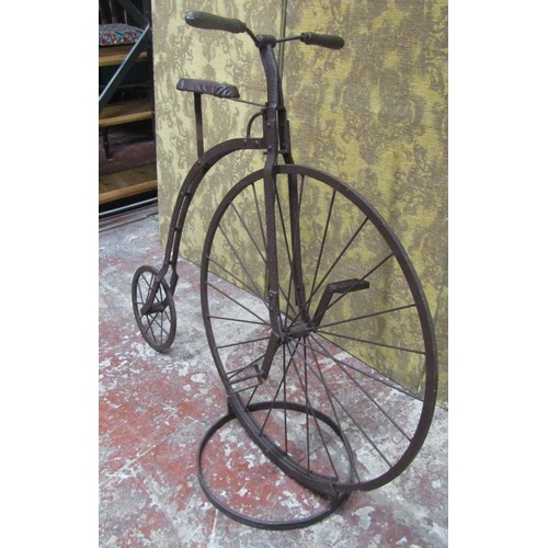 562A - A decorative model penny farthing bicycle, 105cm high