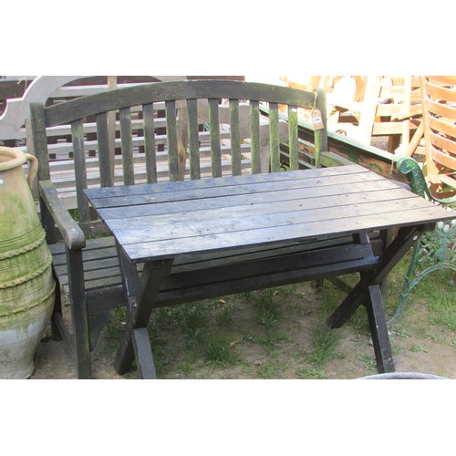 280 - A weathered teak two seat garden bench with slatted seat and back beneath an arched rail 122 cm wide... 